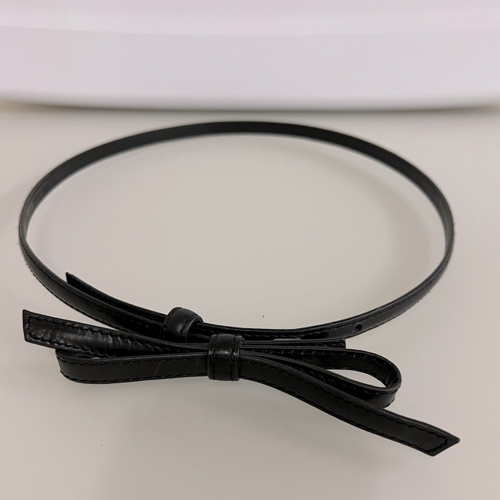 Belt by Saks Fifth Avenue. Classic black belt with bow closure. Size S.